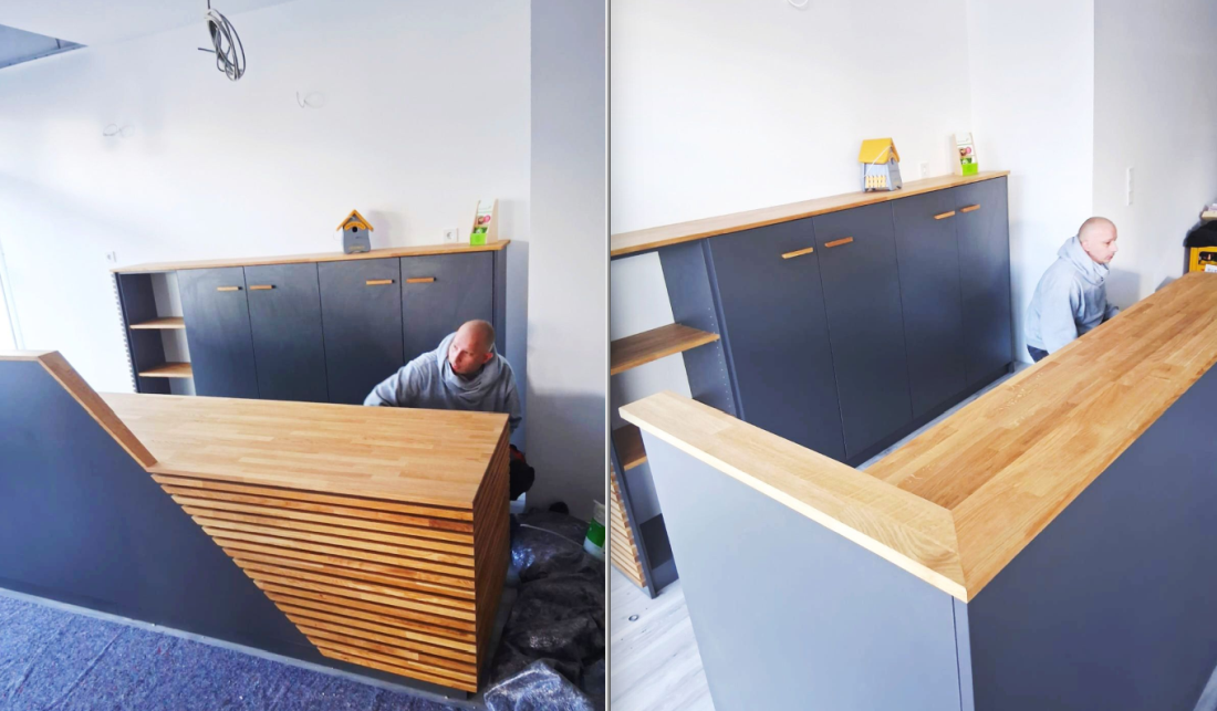 Fabian gibt dem Empfangstresen den letzten Schliff.